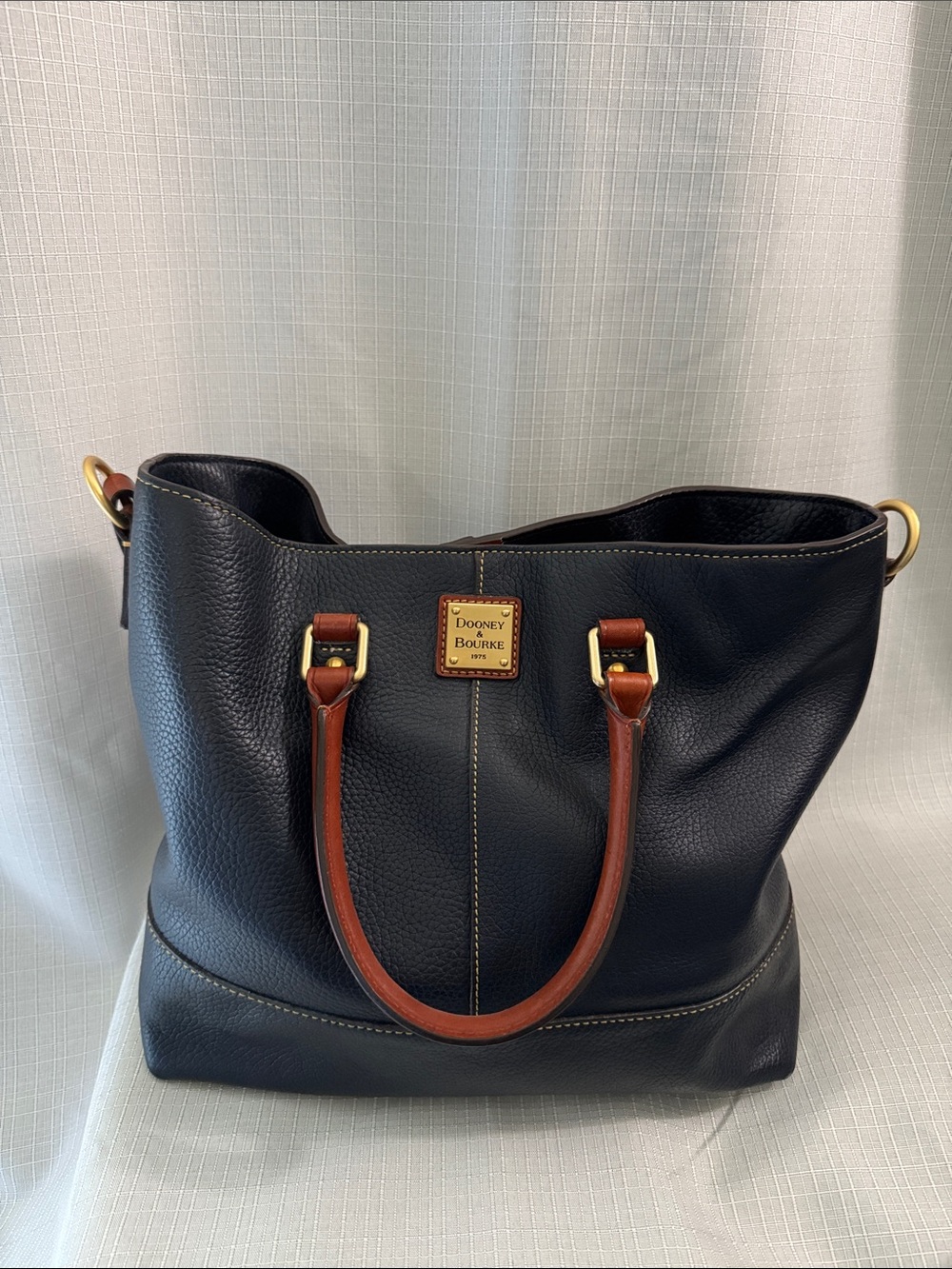 Dooney & Bourke Navy Pebble Leather Tote with Brown Handles and Gold Hardware